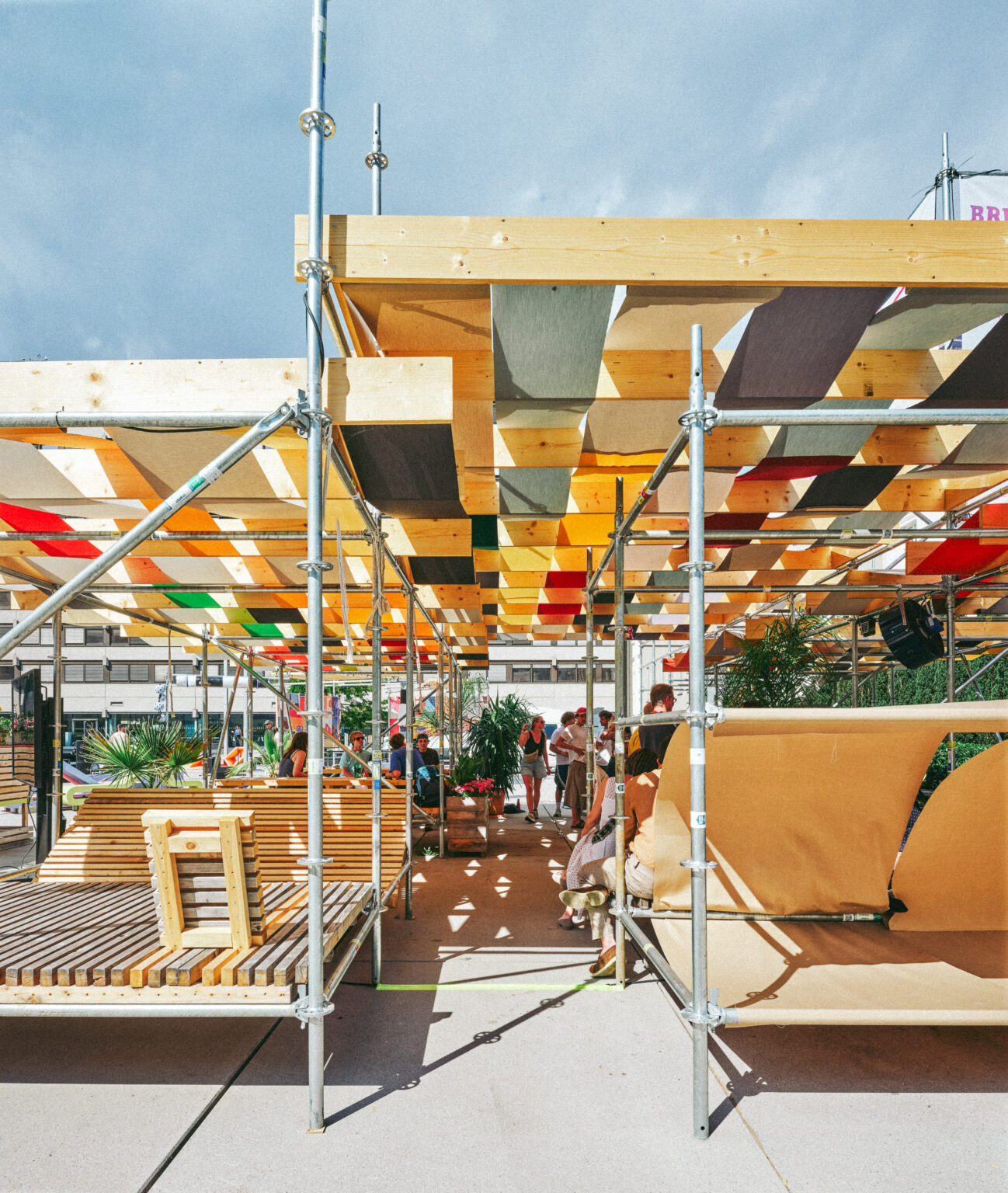 Under the coloured fabric canopy