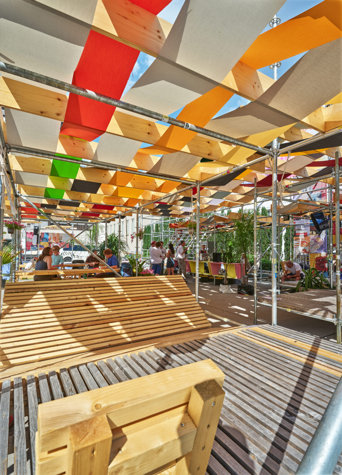 Timber benches beneath the canopy